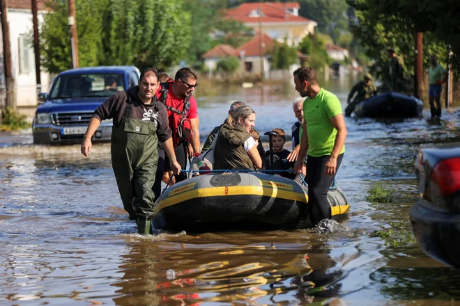 Škodo zaradi poplav je za zdaj težko oceniti. FOTO: Giorgos Moutafis/Reuters