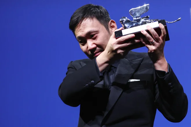 Nagrajeni japonski režiser Ryusuke Hamaguchi. FOTO: Guglielmo Mangiapane/Reuters
