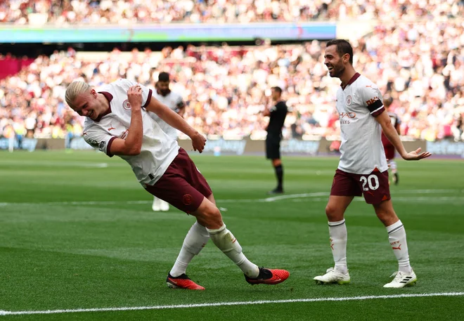 Erling Haaland in Bernardo Silva sta se golov za ManCity veselila po svoje. FOTO: Andrew Boyers/Reuters