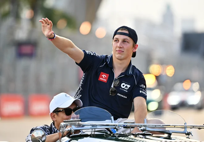 Novozelandec Liam Lawson se je veselil svojih prvih dveh točk v formuli 1. FOTO: Andy Chua/Reuters