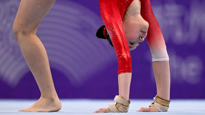 Fotografija: Azijada v Hangzhouju je z 12.500 športniki presegla OI (v Parizu pričakujejo prihodnje leto okoli 10.500 športnikov) in ustvarila impozantno sliko rastoče celine kot zibelke najstarejših civilizacij in vir največje moči za prihodnost. FOTO: William West/AFP