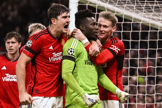 Harry Maguire in Andre Onana sta kljub kritikam vztrajala in postala nepričakovana junaka rdečih vragov. FOTO: Paul Ellis/AFP