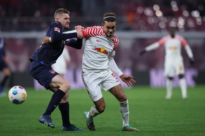 Danec Yussuf Poulsen (desno) je potrdil zmago Leipziga. FOTO: Ronny Hartmann/AFP