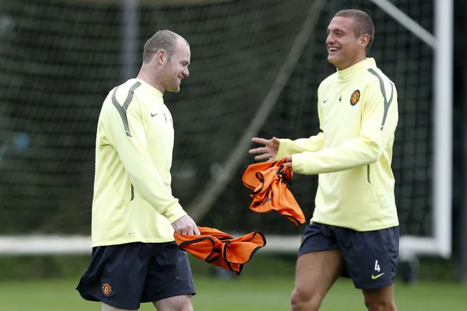 Nemanja Vidić (desno; levo Wayne Rooney) je nekoč blestel v dresu Manchestra Uniteda. FOTO: Phil Noble/Reuters