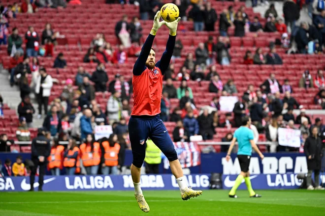 Jan Oblak s soigralci pri Atleticu nima skrbi glede nadaljevanja sezone v ligi prvakov. FOTO: Javier Soriano/AFP