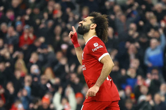 Mohamed Salah je zastreljal 11-metrovko, a vseeno vpisal dva gola. FOTO: Carl Recine/Reuters