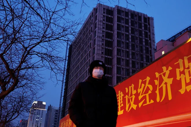 A person walks past Central Plaza, an unfinished development by China Evergrande Group, in Shijiazhuang city centre, Hebei province, China February 1, 2024. REUTERS/Tingshu Wang