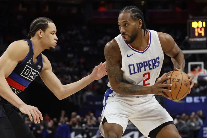 Kawhi Leonard (z žogo) je bil znova zelo razpoložen. FOTO: Rick Osentoski/Usa Today Sports