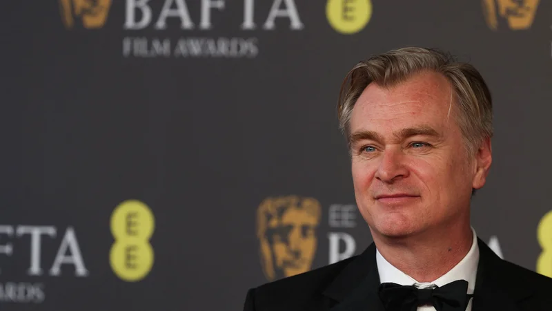 V tretje gre rado. Britanski režiser Christopher Nolan je po dveh nominacijah naposled dočakal prvo bafto. FOTO: Adrian Dennis/AFP