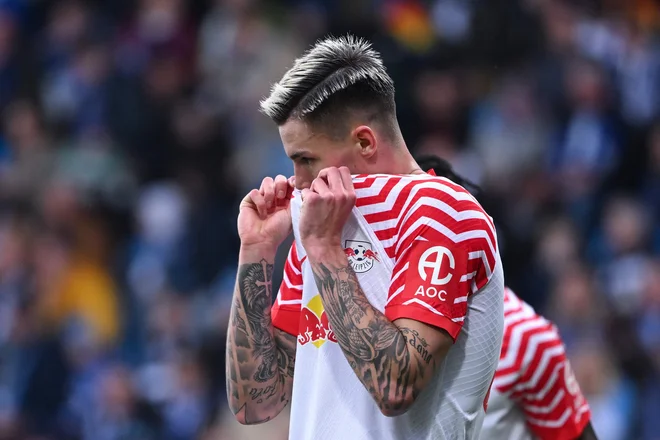 Benjamin Šeško je v novem kolu bundeslige vpisal podajo. FOTO: Ina Fassbender/AFP