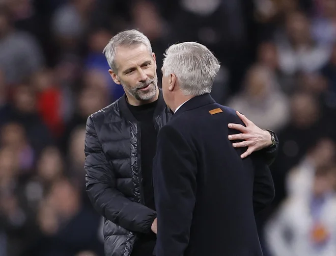 Trenerja Reala Carlo Ancelotti (desno) in Leipziga Marco Rose FOTO: Juan Medina/Reuters