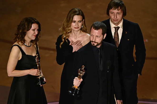 Ukrajinski režiser Mstislav Černov, ki je dobil oskarja za najboljši dokumentarni film. FOTO: Patrick T. Fallon/AFP