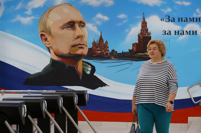 Moskovski plakat v času lanskih septembrskih lokalnih volitev v samooklicani marionetni Doneški ljudski republiki v Ukrajini. FOTO: Alexander Ermochenko/Reuters