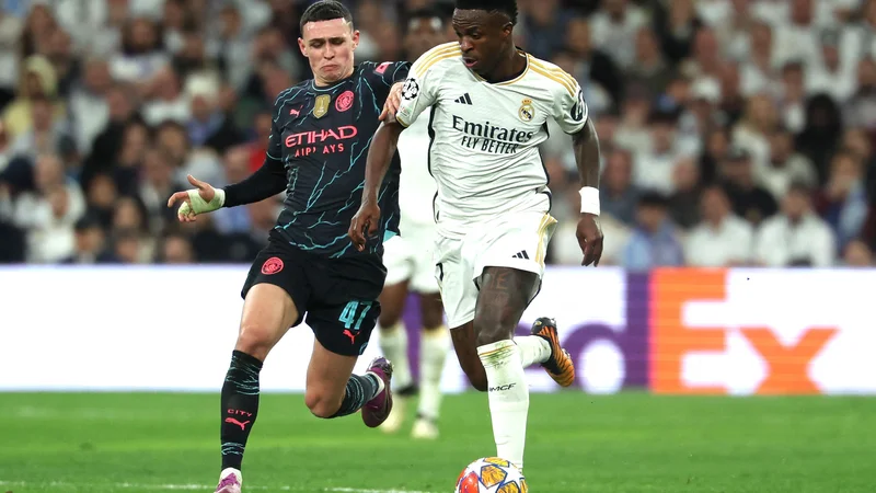 Vinicius in Phil Foden sta bila znova izstopajoča posameznika v svojih ekipah. FOTO: Pierre-Philippe Marcou/AFP