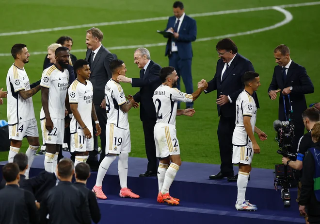 Aleksander Čeferin in Florentino Perez se ne ljubita, a liga prvakov in Real Madrid sta blagovni znamki, ki druga drugo spodbujata in delata boljšo. FOTO: Sarah Meyssonnier/Reuters