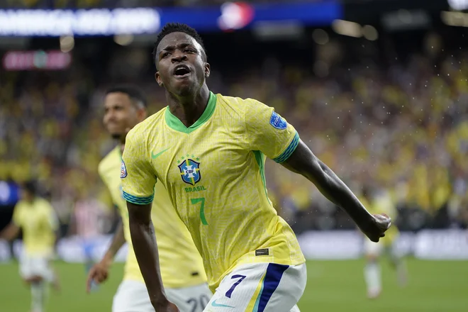 Vinicius Junior še naprej igra v  vrhunski formi. FOTO: Lucas Peltier/Reuters