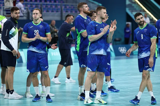 Slovenci so igrišče zapustili z dvignjenimi glavami. FOTO: Sameer Al-doumy/AFP