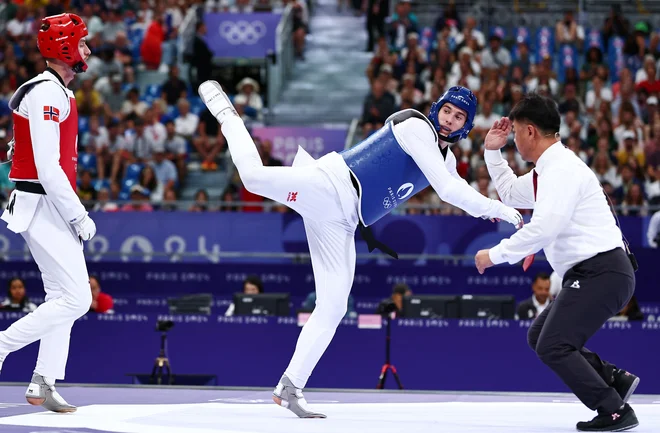 Patrik Divković (desno) je namučil favorita. FOTO: Tingshu Wang/ Reuters