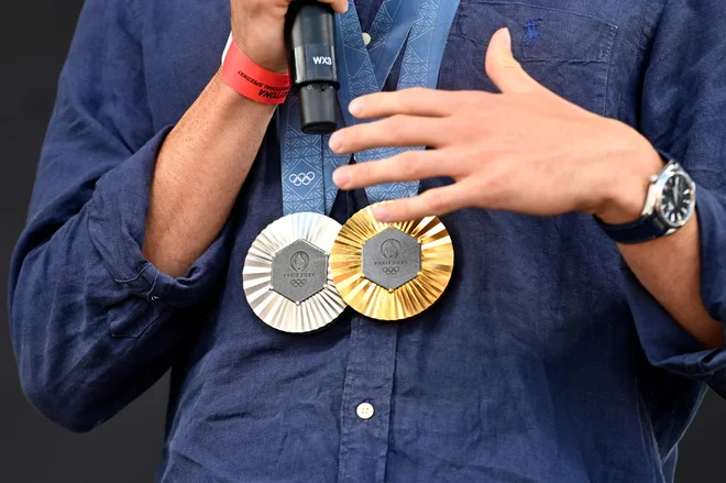 Vojne, gospodarska kriza, inflacija. Nič kaj zlati časi. Še zlate medalje niso več zlate, ampak - srebrne. FOTO: Logan Riely/Afp