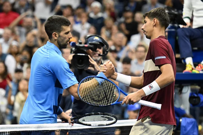 Novak Đoković in Alexei Popyrin FOTO: Angela Weiss/AFP