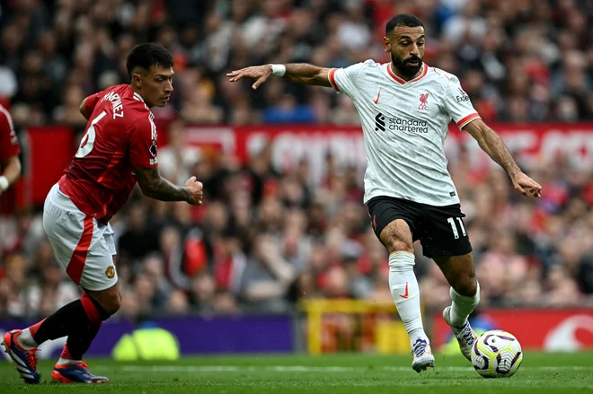 Mohamed Salah je nadaljeval odličen strelski niz na derbijih z Unitedom. FOTO: Paul Ellis/AFP