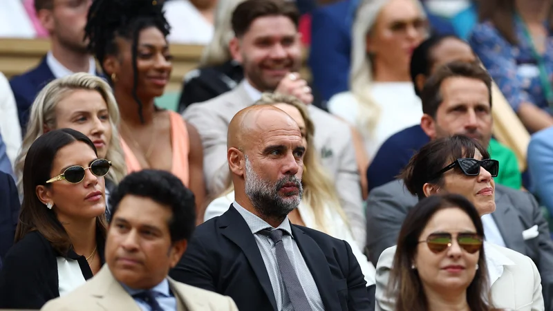 Pep Guardiola in Cristina (desno) sta si lani skupaj ogledala teniški turnir v Wimbledonu. FOTO: Hannah Mckay/Reuters