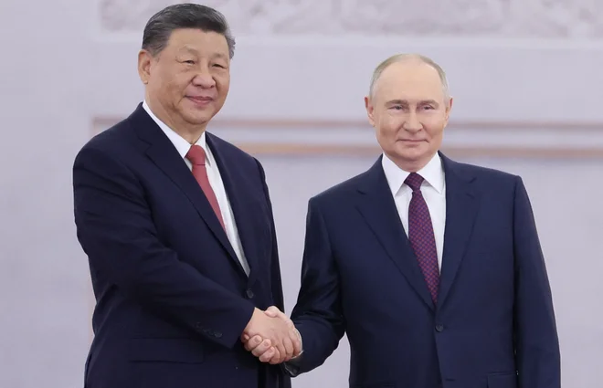 Xi in Putin v Moskvi z zagotovili podpore in sodelovanja. FOTO: Mikhail Metzel/Reuters