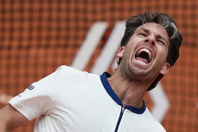 Cameron Norrie se je veselil zmage. FOTO: Dimitar Dilkoff/AFP