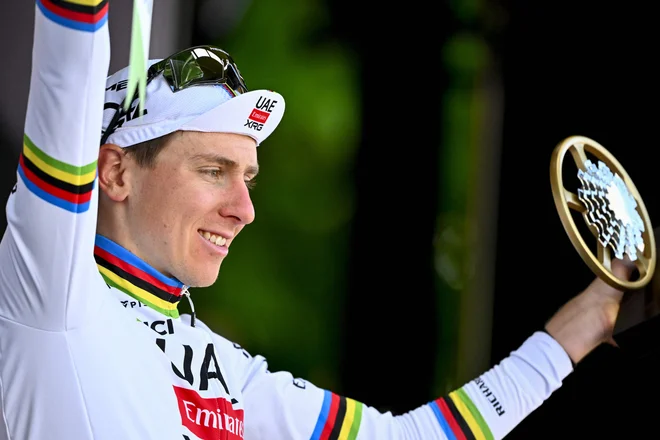 Tadej Pogačar je še povečal naskok na lestvici UCI. FOTO: Eric Lalmand/AFP