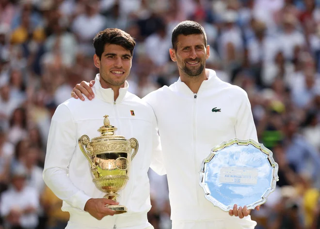 Carlos Alcaraz je lani v finalu Wimbledona premagal Novaka Đokovića. Foto Paul Childs/Reuters