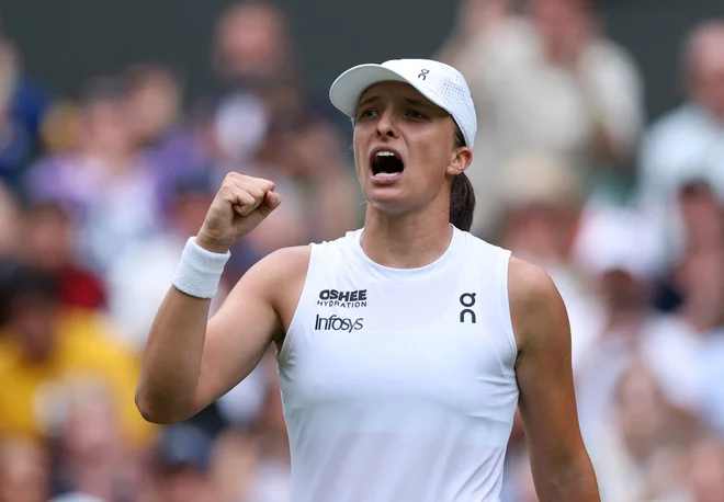 Iga Šwiatek je premagala Danielle Collins. FOTO: Toby Melville/Reuters