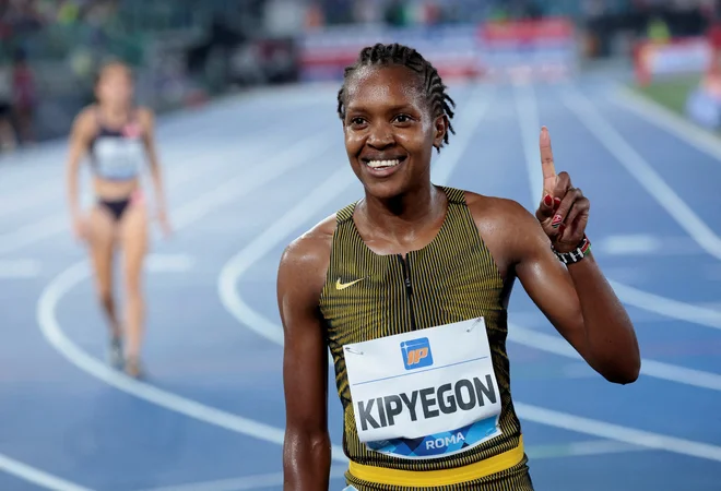 Faith Kipyegon se je veselila rekorda. FOTO: Remo Casilli/Reuters