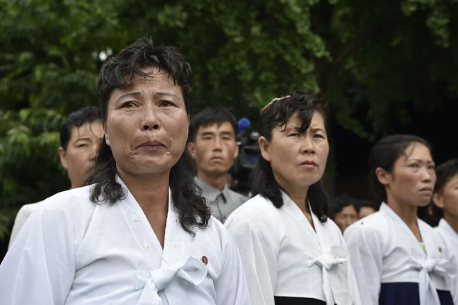 Pjongjang je v preteklosti vabil prebežnike z lažnimi obljubami o »raju na Zemlji«. FOTO: Kim Won Jin/AFP