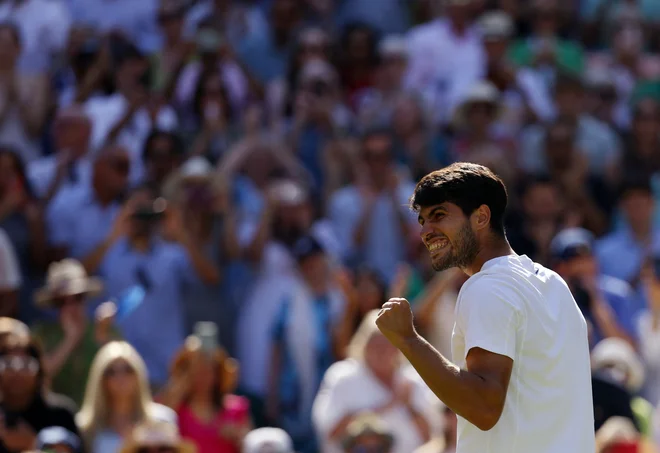 Carlos Alcaraz se je veselil uvrstitve v finale. FOTO: Andrew Couldridge/Reuters