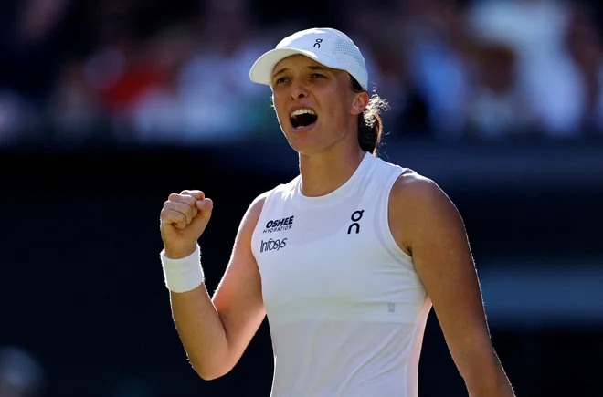 Iga Šwiatek se je prvič uvrstila v wimbledonski finale. FOTO: Stephanie Lecocq/Reuters