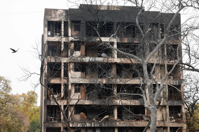 Uničujoče posledice letalske nesreče. FOTO: Adnan Abidi/Reuters