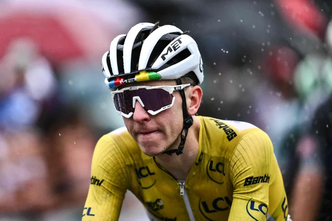 Tadej Pogačar se veseli kraljevske 18. etape. FOTO: Marco Bertorello/AFP