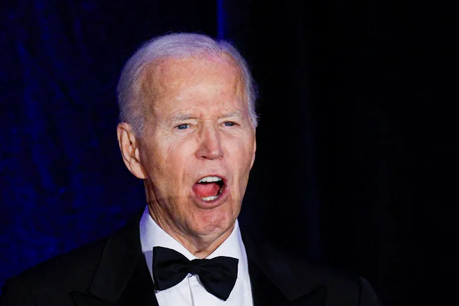 Prejšnji demokratski predsednik Joe Biden je spodbujal DEI. FOTO: Kamil Krzaczynski/Reuters
